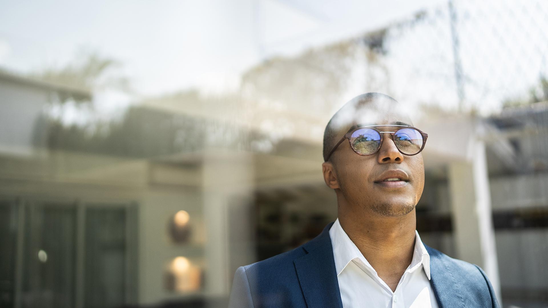 Businessman looking out of window