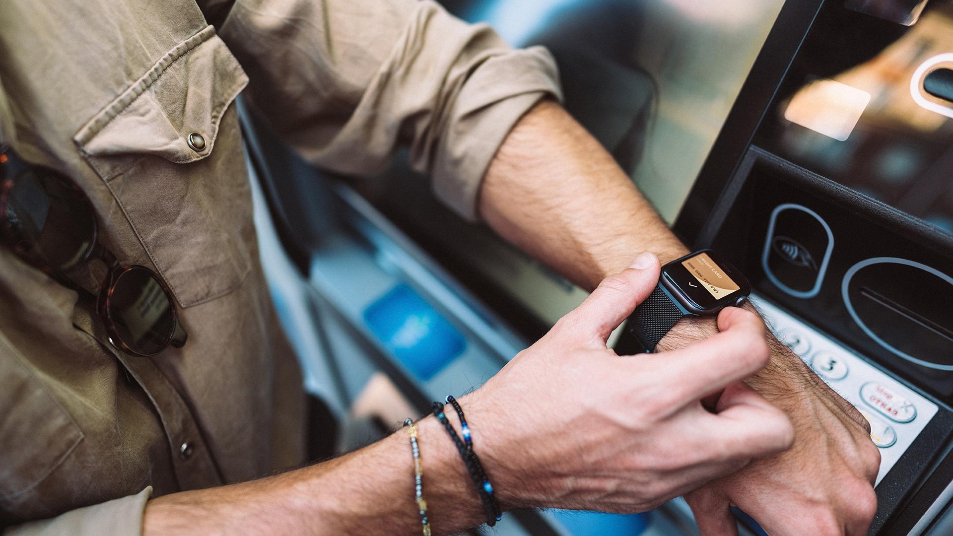 Man withdrawing money with smartwatch