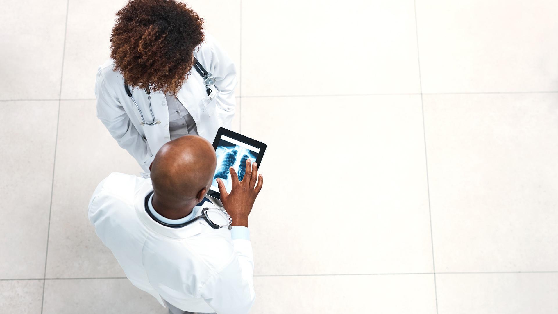 Two doctors determining the cause of their patient's condition