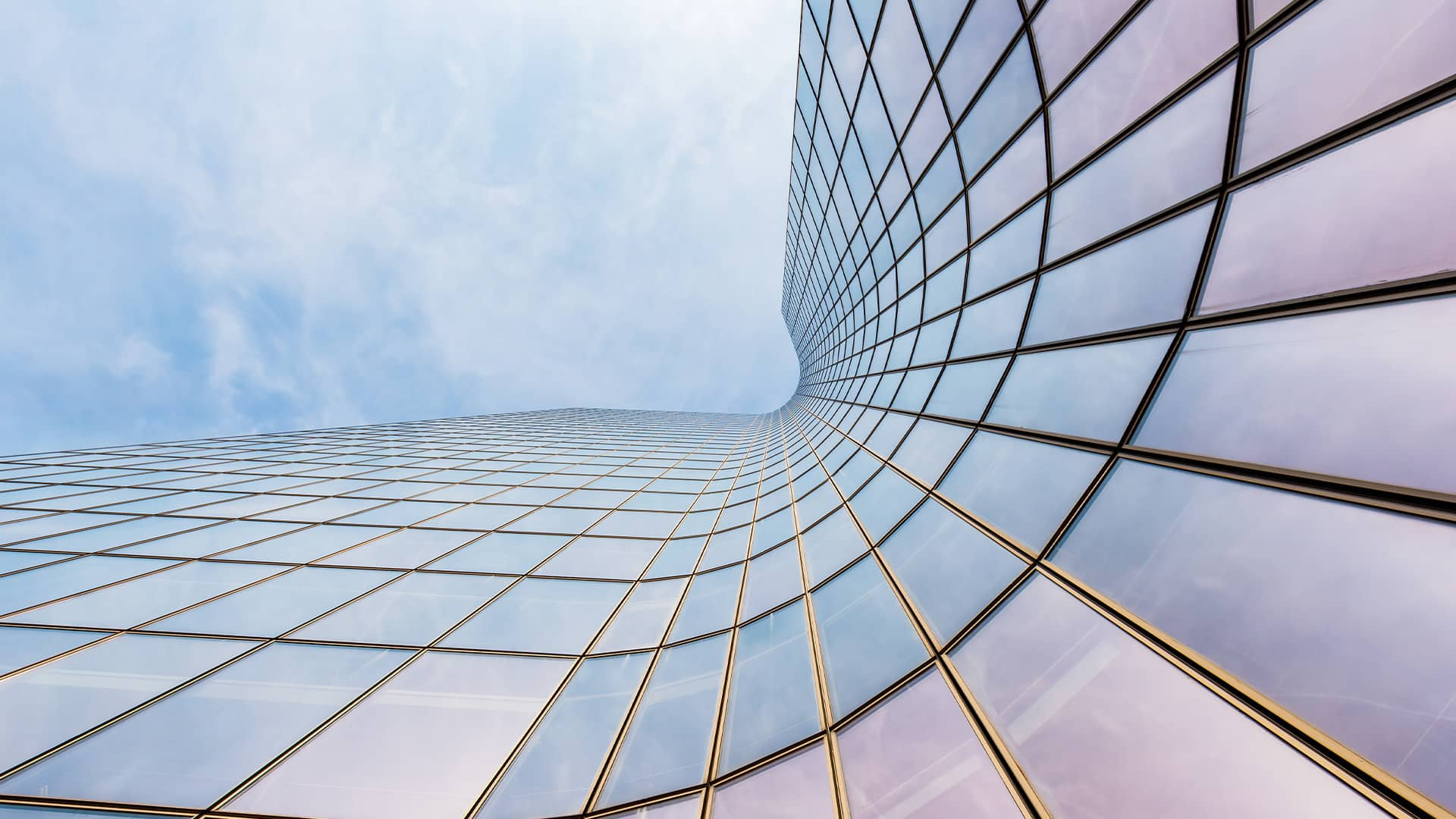  Curved skyscraper against blue sky