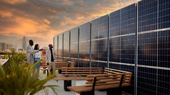 Broker and Prospective Buyers Admiring Solar Energy System