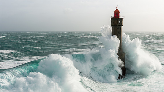 La Jument lighthouse being struck by a 15m high wave during the 2016 winter storm Ruzica.