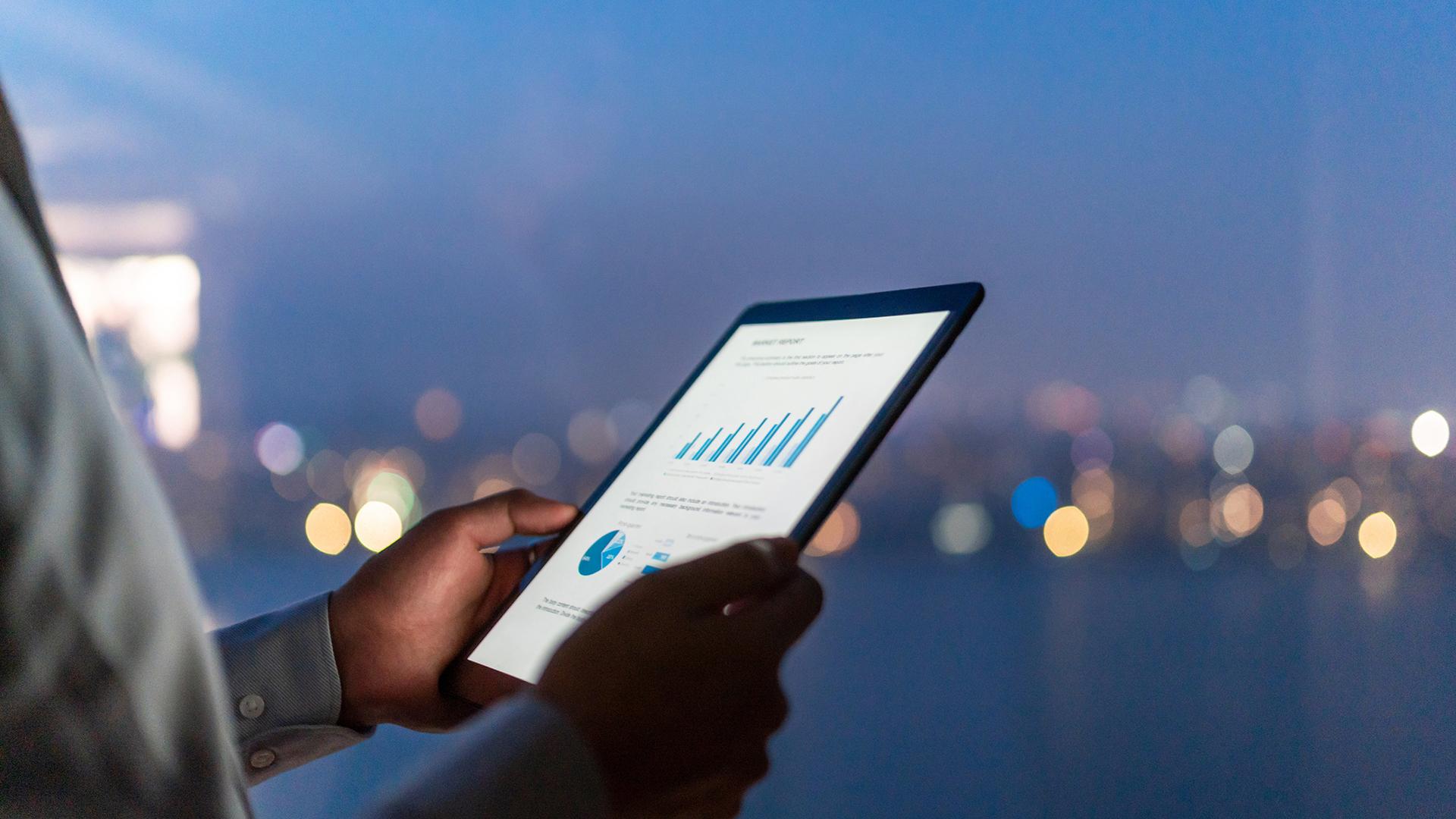 Buesiness person using a tablet in modern office