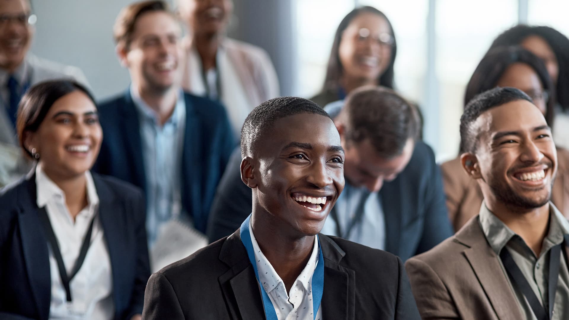 Group of business persons smiling at a conference