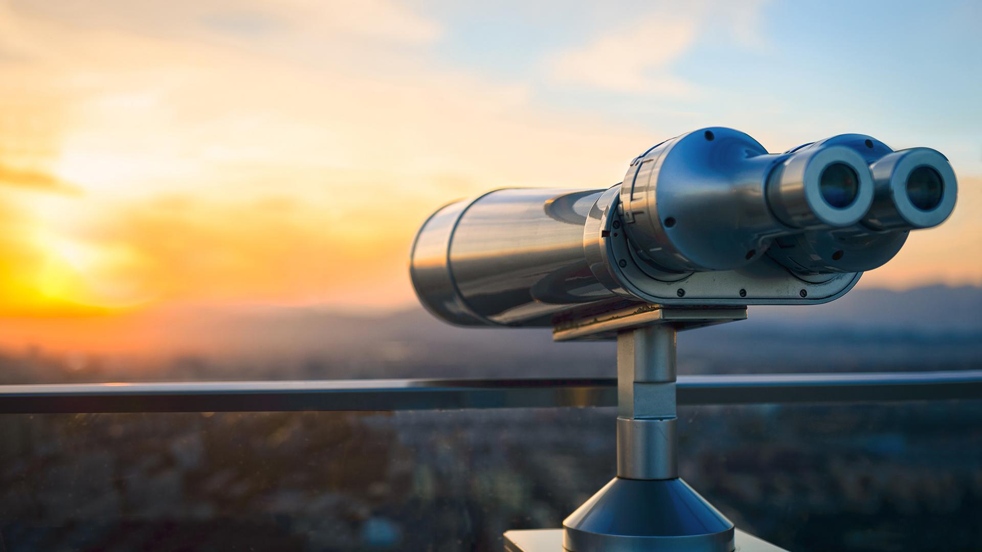 A scenic overview with a large pair of binoculars in view.