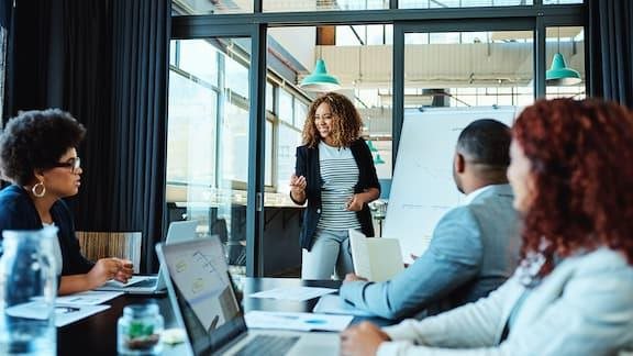 Shot of a businesswoman giving a presentation to her colleagues in an office