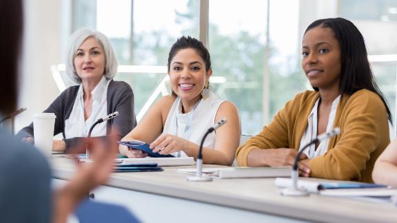 Diverse panel of women answer questions during expo