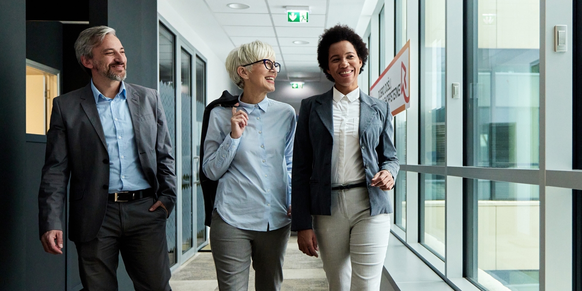 Advisors walking while discussing plans