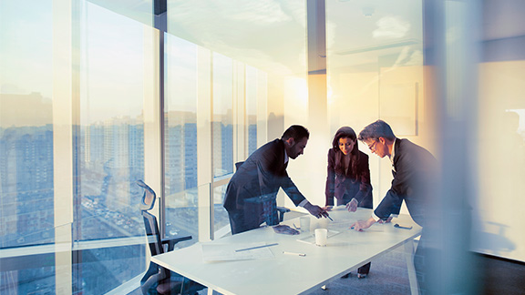 Business colleagues planning together in meeting - stock photo