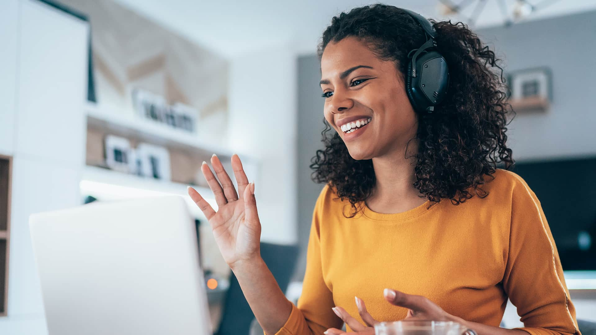 Young modern woman having Video Conference at home