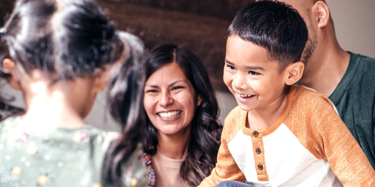 Laughing family with two kids