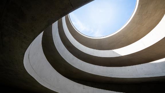 A swirling, modern parking ramp.