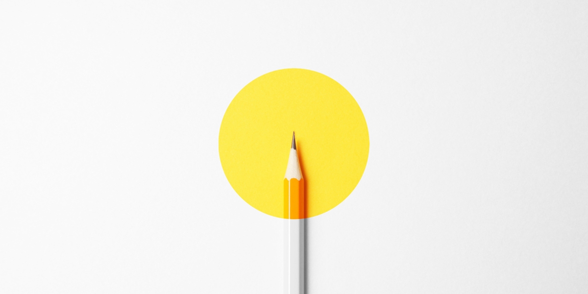 Pencil on white and yellow background.